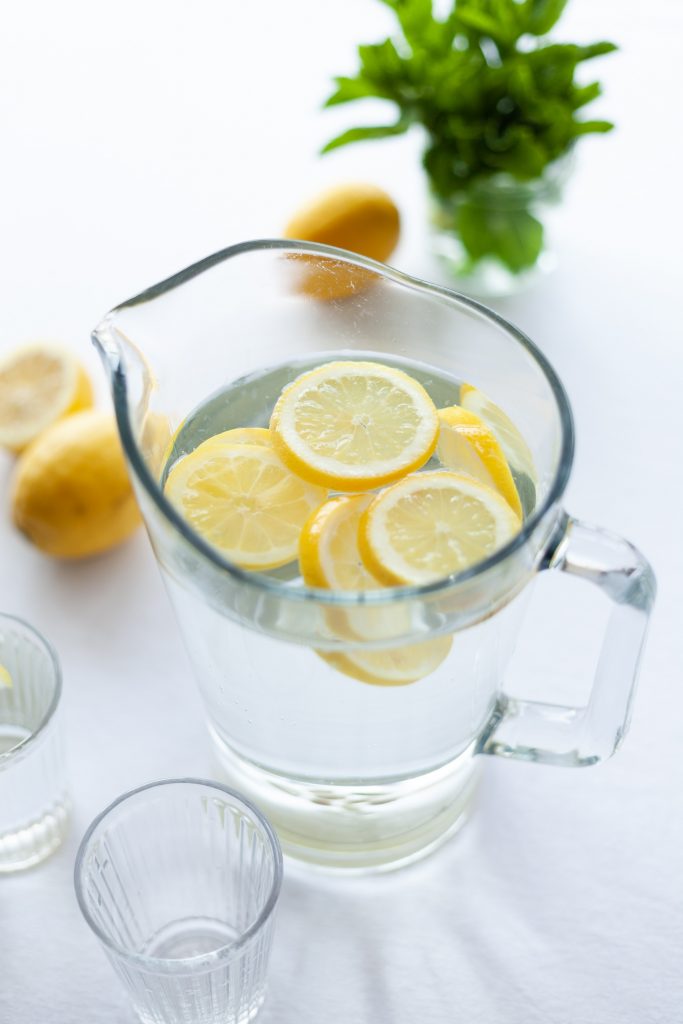 pitcher of drinking water with lemons